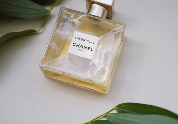 Bottle of Gabrielle by Chanel laying on a table